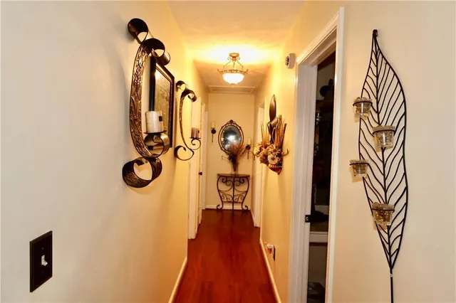 a bedroom with bed and a chandelier