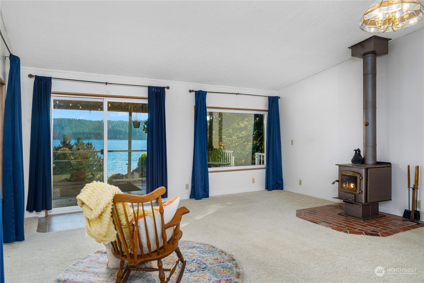 9320 Northeast North Shore Road Belfair, WA 98528 - Photo 25 of 40 a balcony with table and chairs