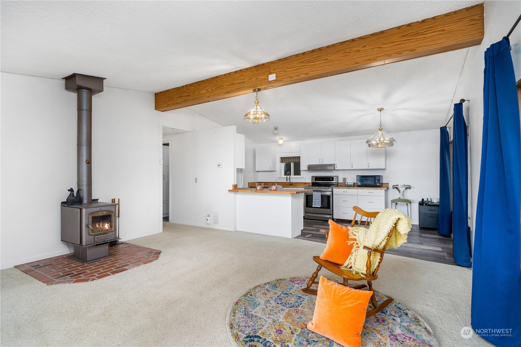 9320 Northeast North Shore Road Belfair, WA 98528 - Photo 28 of 40 a living room with stainless steel appliances furniture and a kitchen view