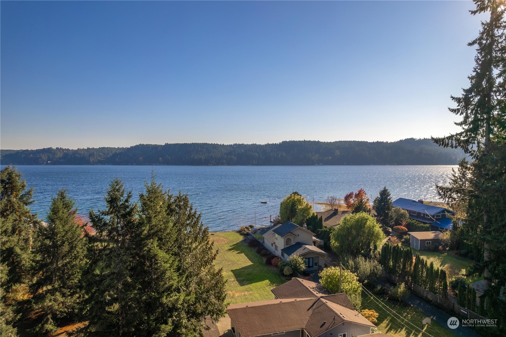 9320 Northeast North Shore Road Belfair, WA 98528 - Photo 5 of 40 a view of lake with mountain in background