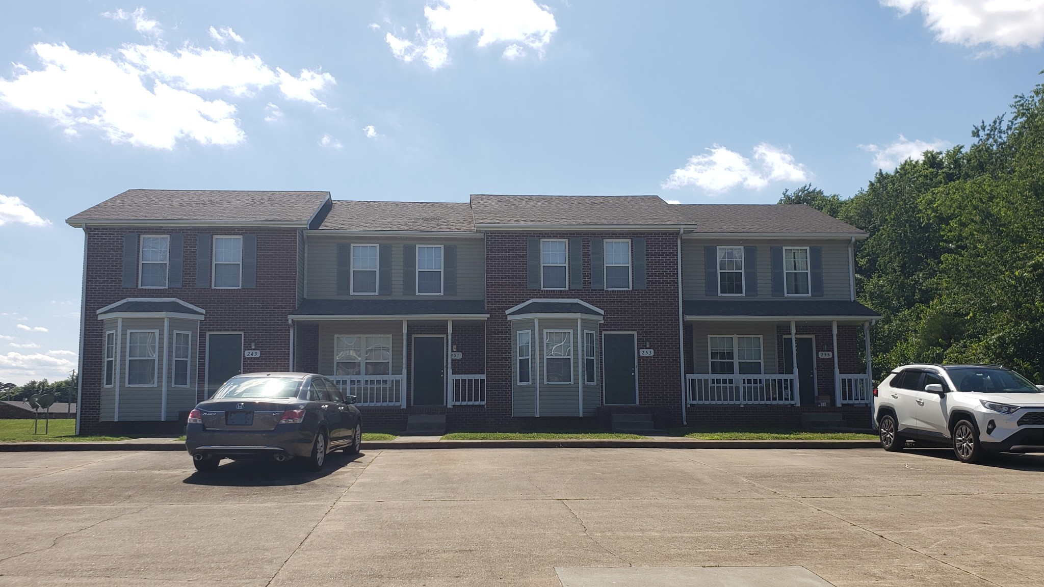 249 Tree Line Drive Oak Grove, KY 42262 - Photo 1 of 2 a car parked in front of a brick house