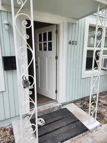 a view of an entryway with wooden floor