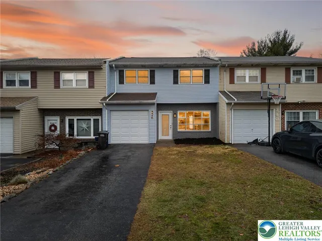 a view of a car parked in front of a house