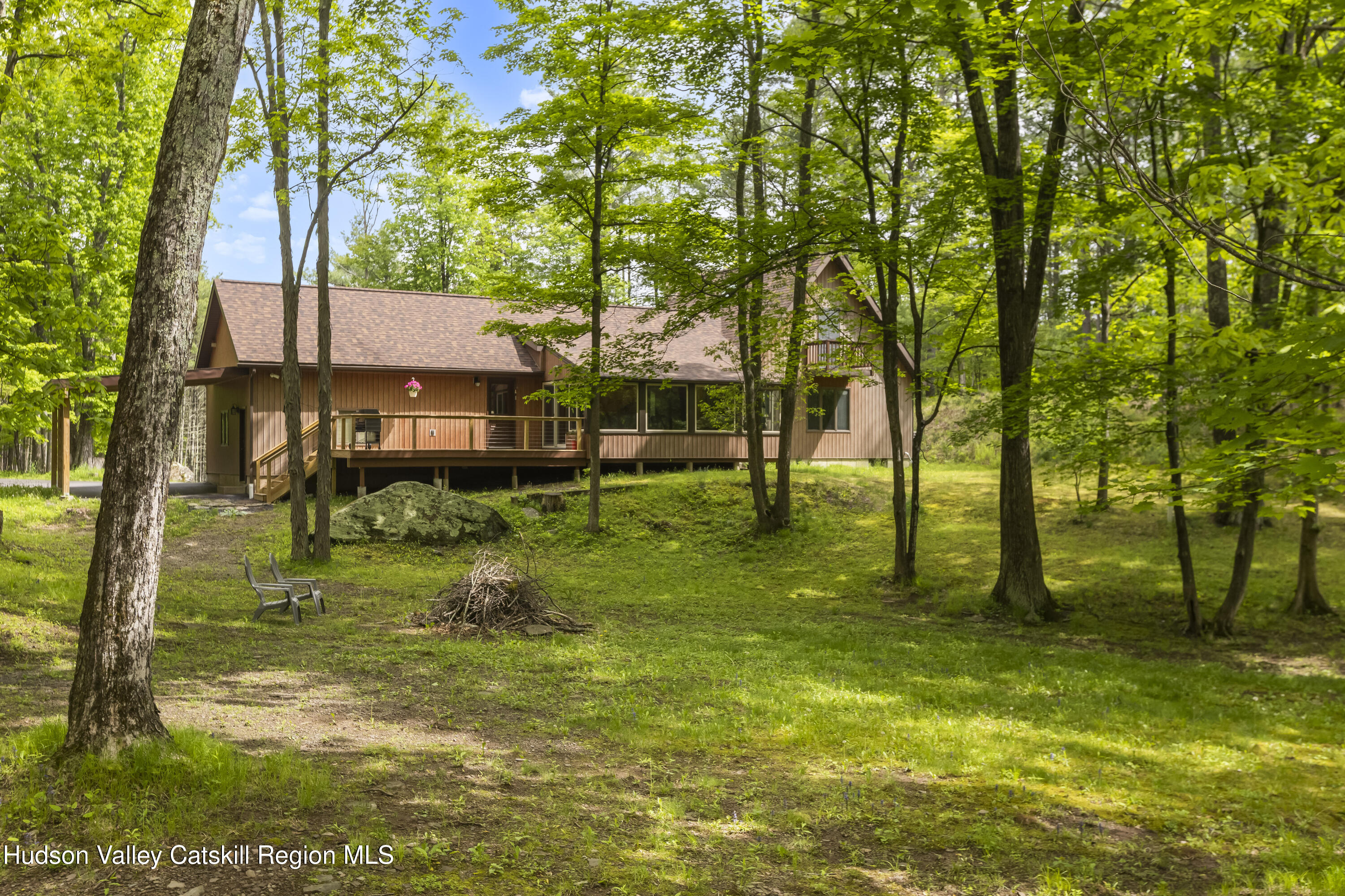 a backyard of a house with lots of green space