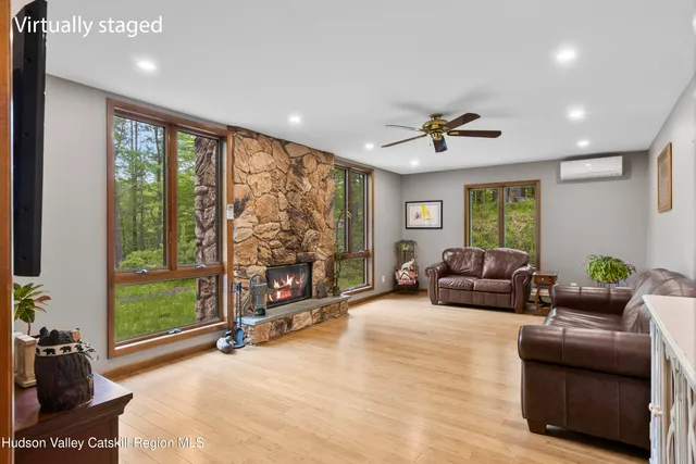 a living room with furniture and a flat screen tv