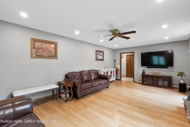 a dining room with furniture and wooden floor