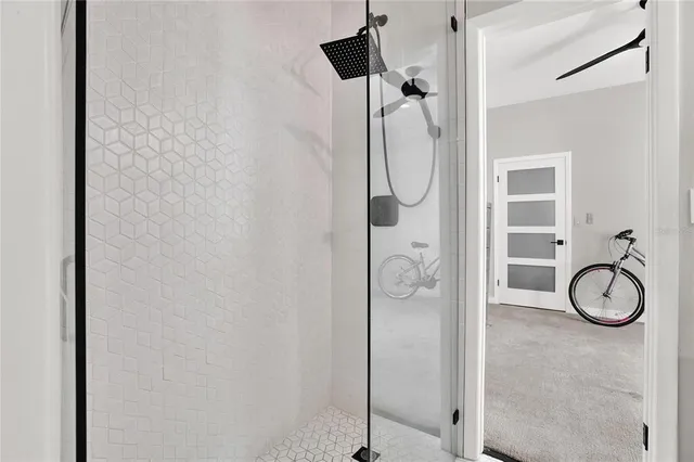a bathroom with a granite countertop shower