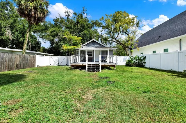 a front view of a house with a yard table and chairs