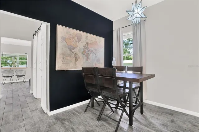 a view of a dining room with furniture window and outside view