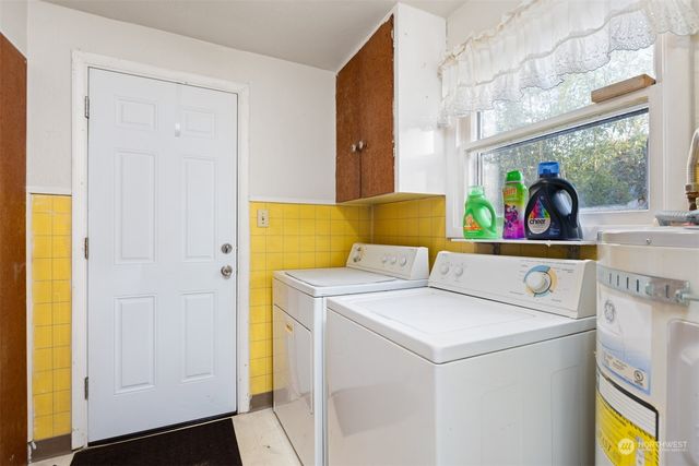 a utility room with dryer and washer