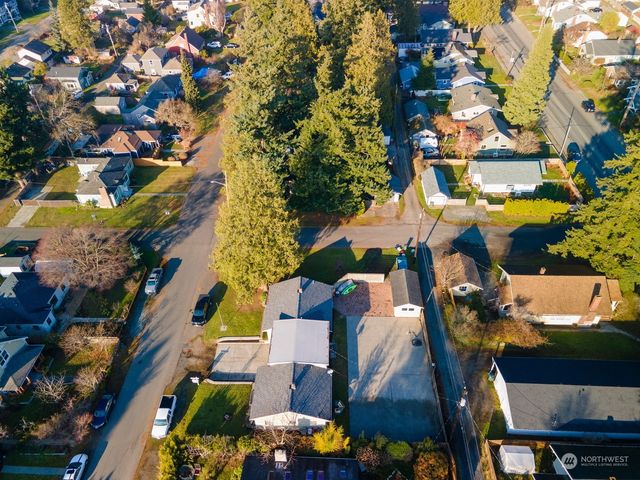 an aerial view of residential houses with outdoor space