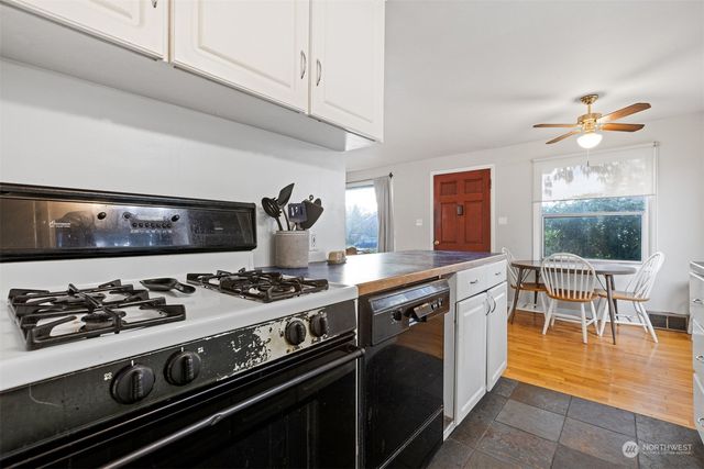 a kitchen with a stove and a sink