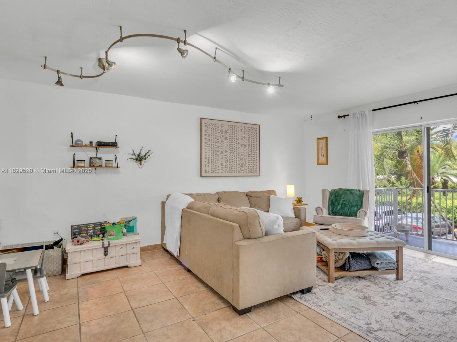 7403 Southwest 82nd Street, Unit 201N Miami, FL 33143 - Photo 16 of 43 a living room with furniture and wooden floor