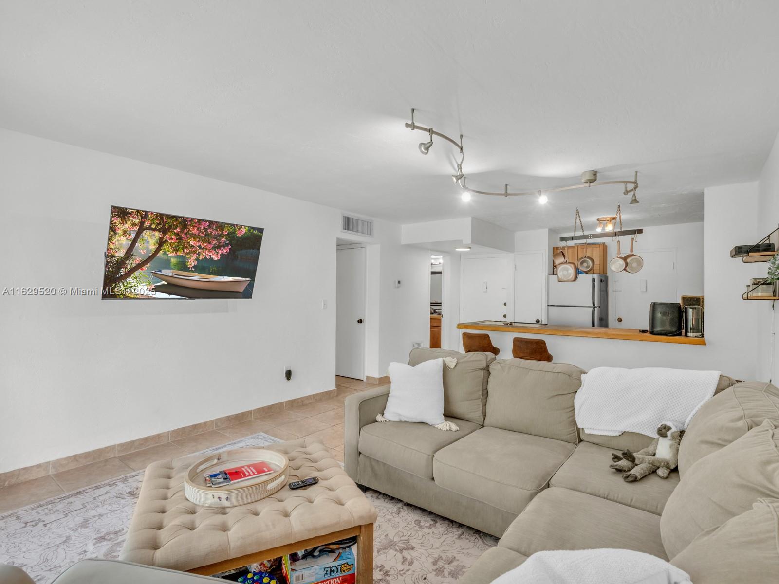 7403 Southwest 82nd Street, Unit 201N Miami, FL 33143 - Photo 19 of 43 a living room with furniture and a couch