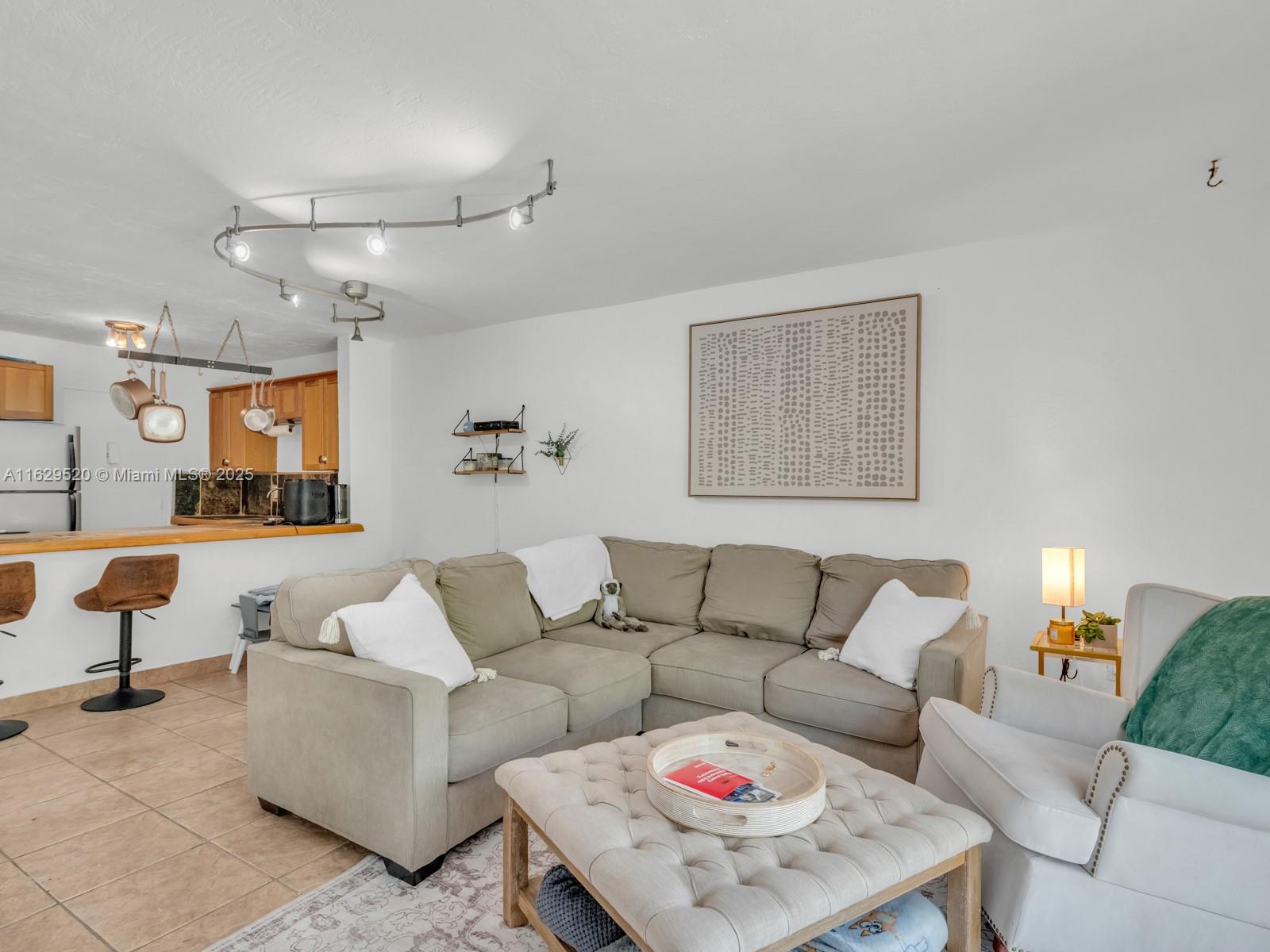 7403 Southwest 82nd Street, Unit 201N Miami, FL 33143 - Photo 20 of 43 a living room with furniture and a couch