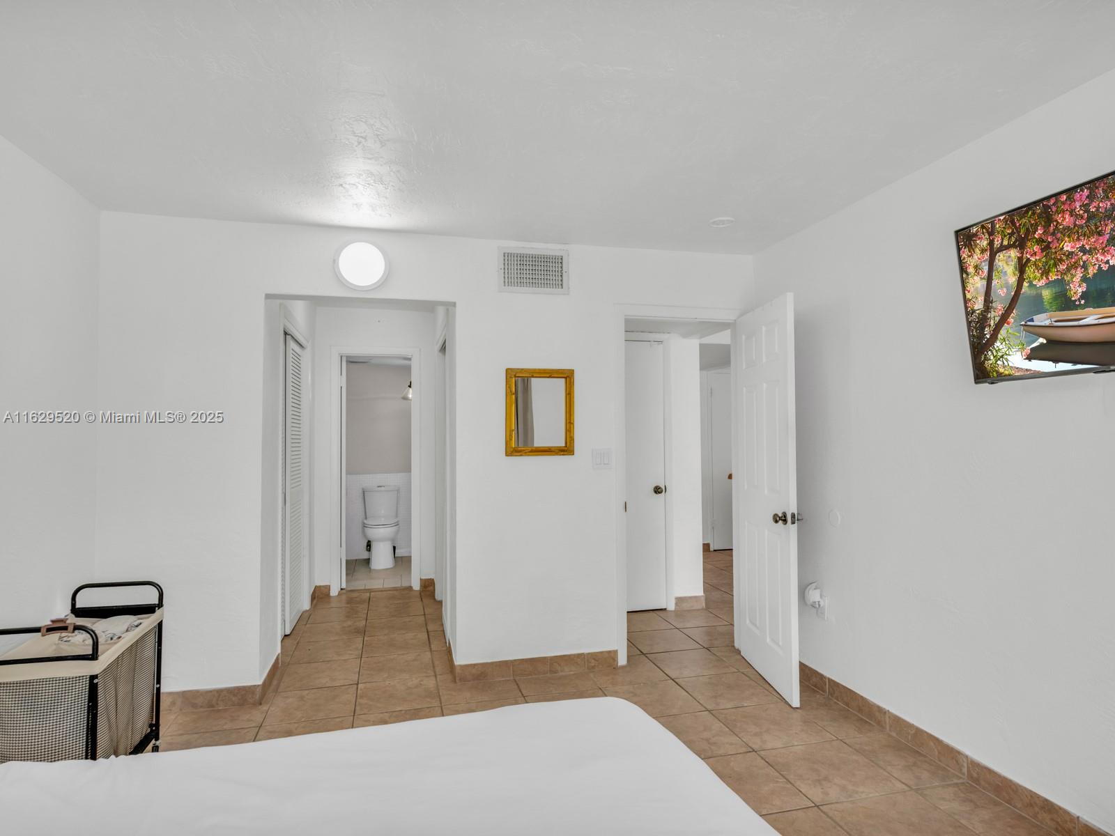 7403 Southwest 82nd Street, Unit 201N Miami, FL 33143 - Photo 25 of 43 a view of a hallway with wooden floor and furniture