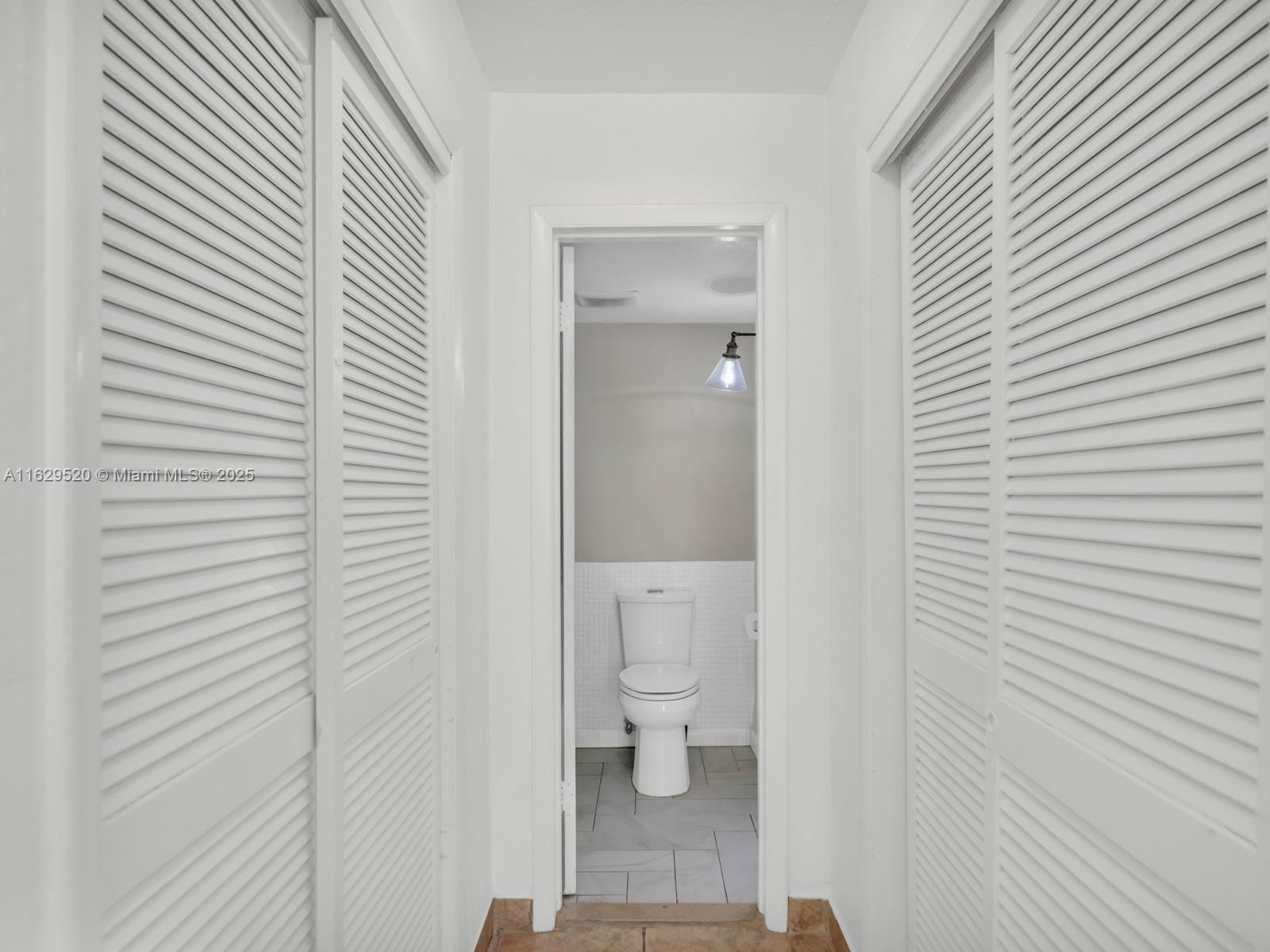 7403 Southwest 82nd Street, Unit 201N Miami, FL 33143 - Photo 26 of 43 a bathroom with a toilet