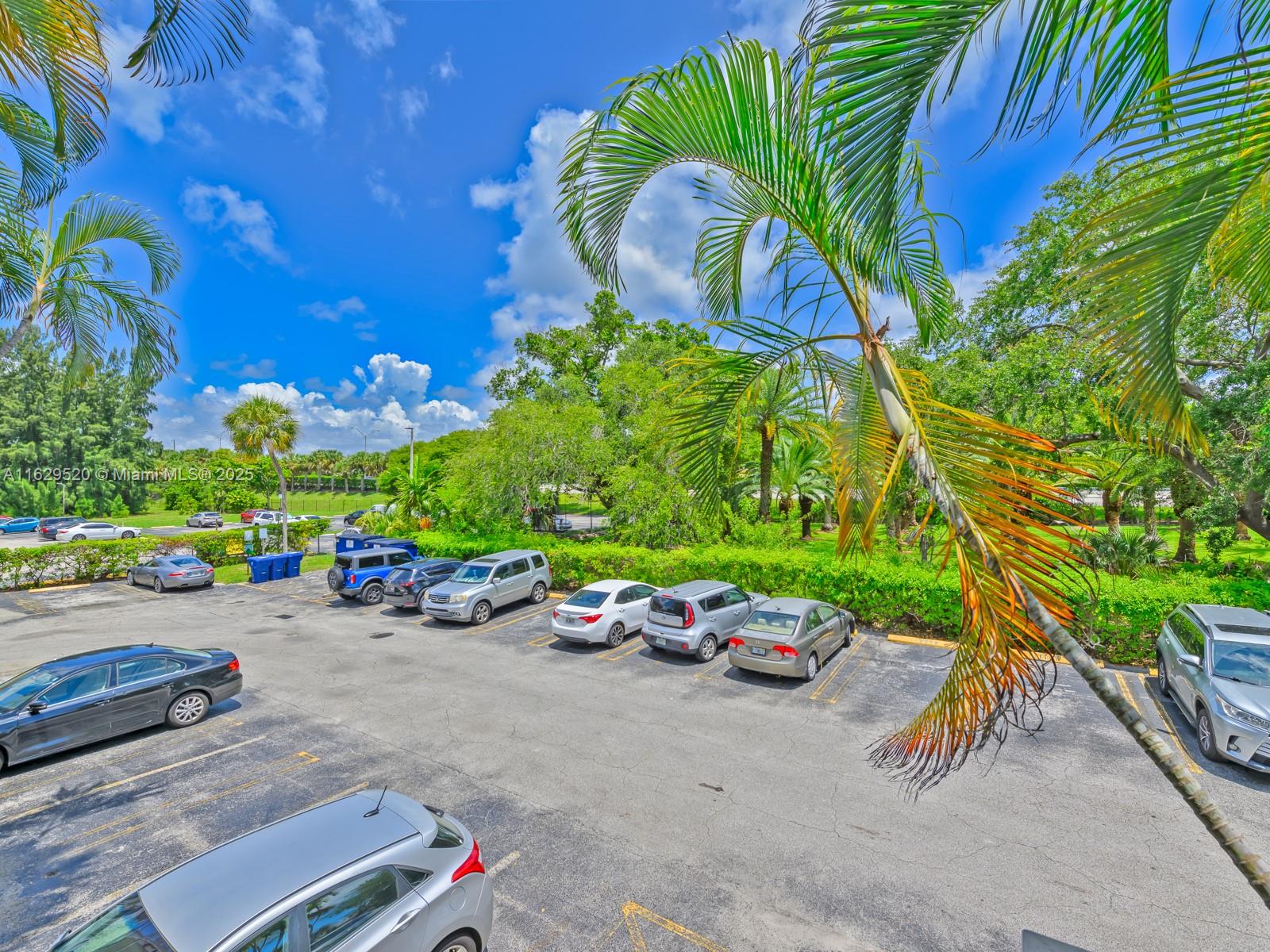 7403 Southwest 82nd Street, Unit 201N Miami, FL 33143 - Photo 29 of 43 a childrens park with lots of swings and slides