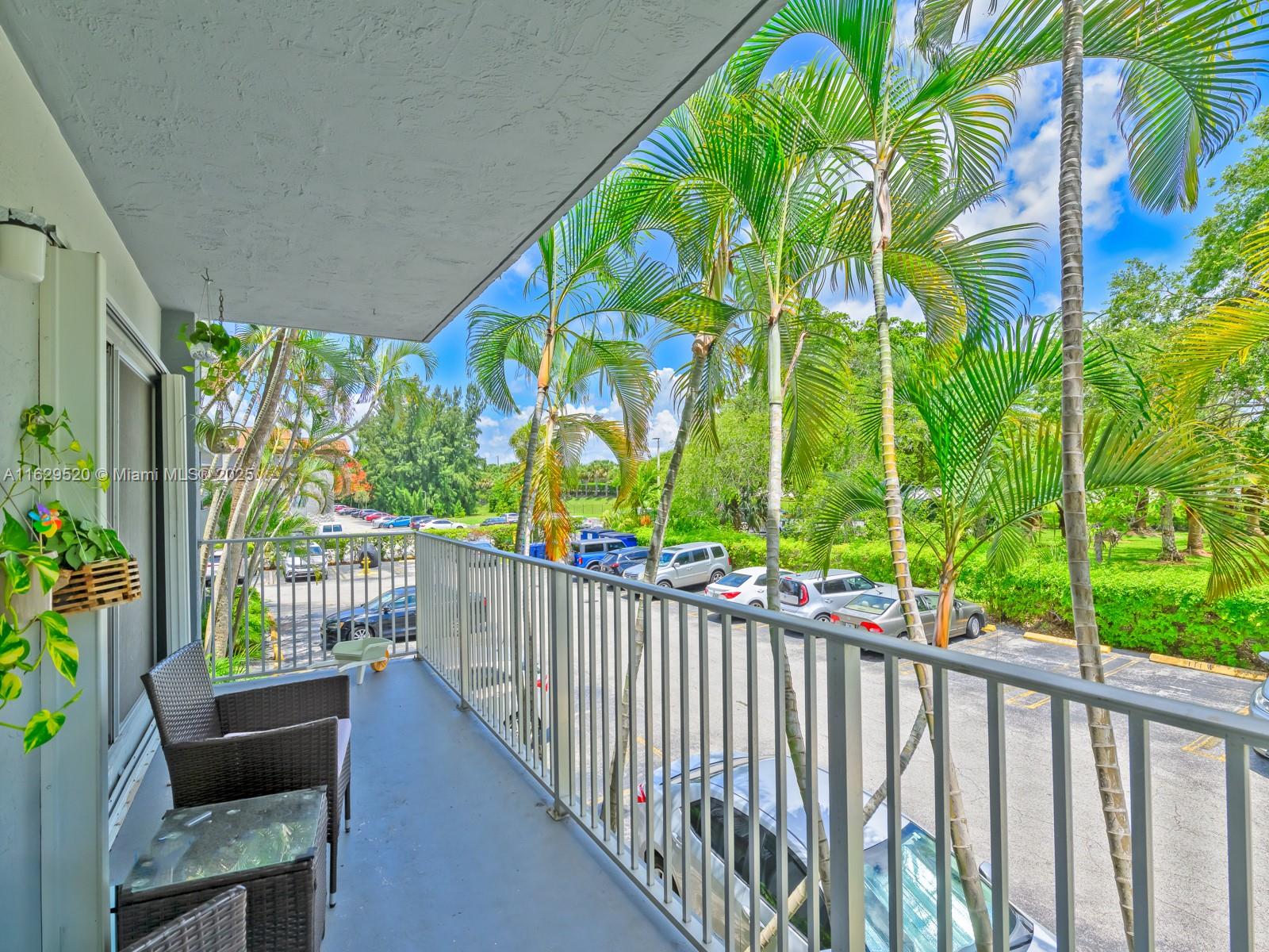 7403 Southwest 82nd Street, Unit 201N Miami, FL 33143 - Photo 30 of 43 a balcony with outdoor space