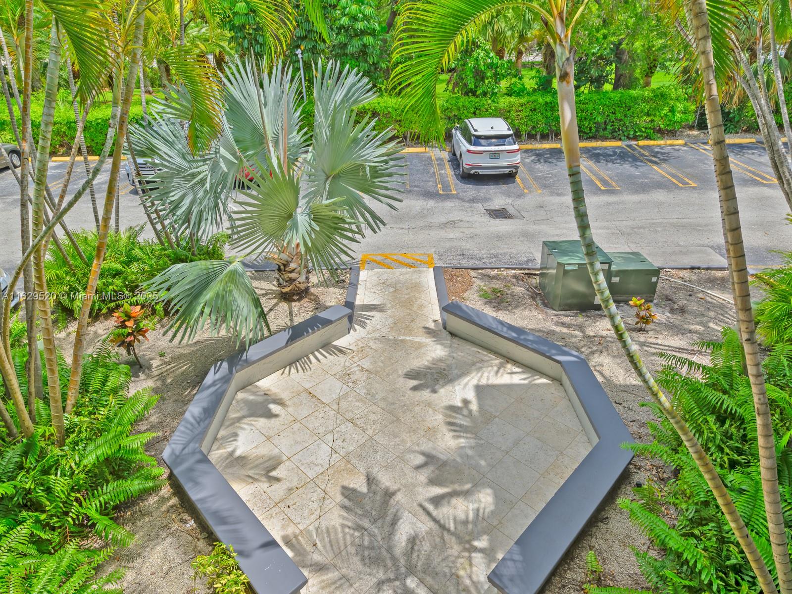 7403 Southwest 82nd Street, Unit 201N Miami, FL 33143 - Photo 33 of 43 a view of a backyard with potted plants