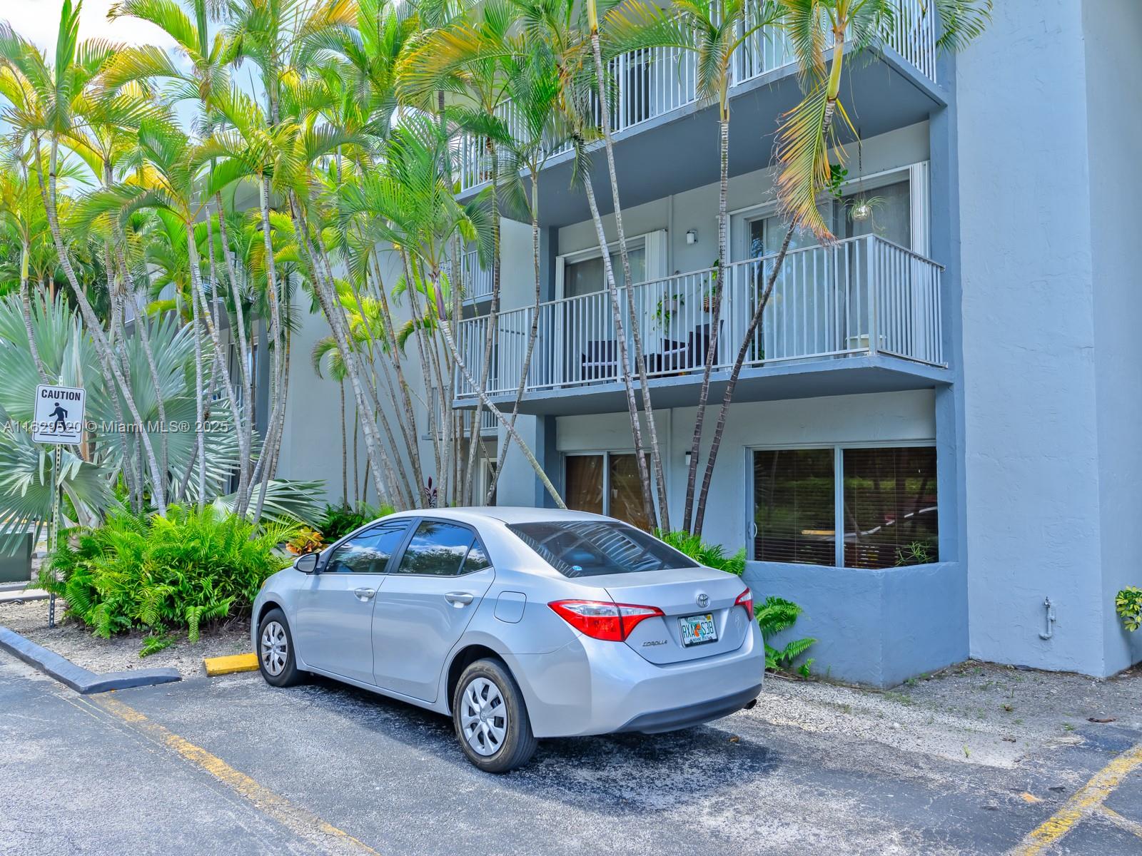 7403 Southwest 82nd Street, Unit 201N Miami, FL 33143 - Photo 34 of 43 a car parked in front of a house