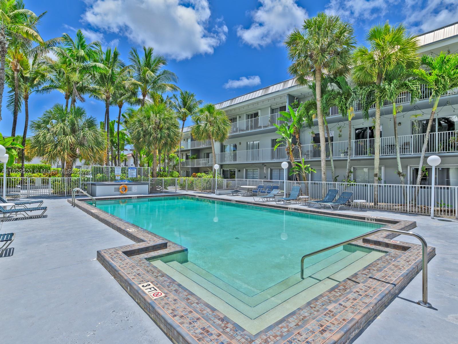7403 Southwest 82nd Street, Unit 201N Miami, FL 33143 - Photo 39 of 43 a view of a swimming pool with a patio