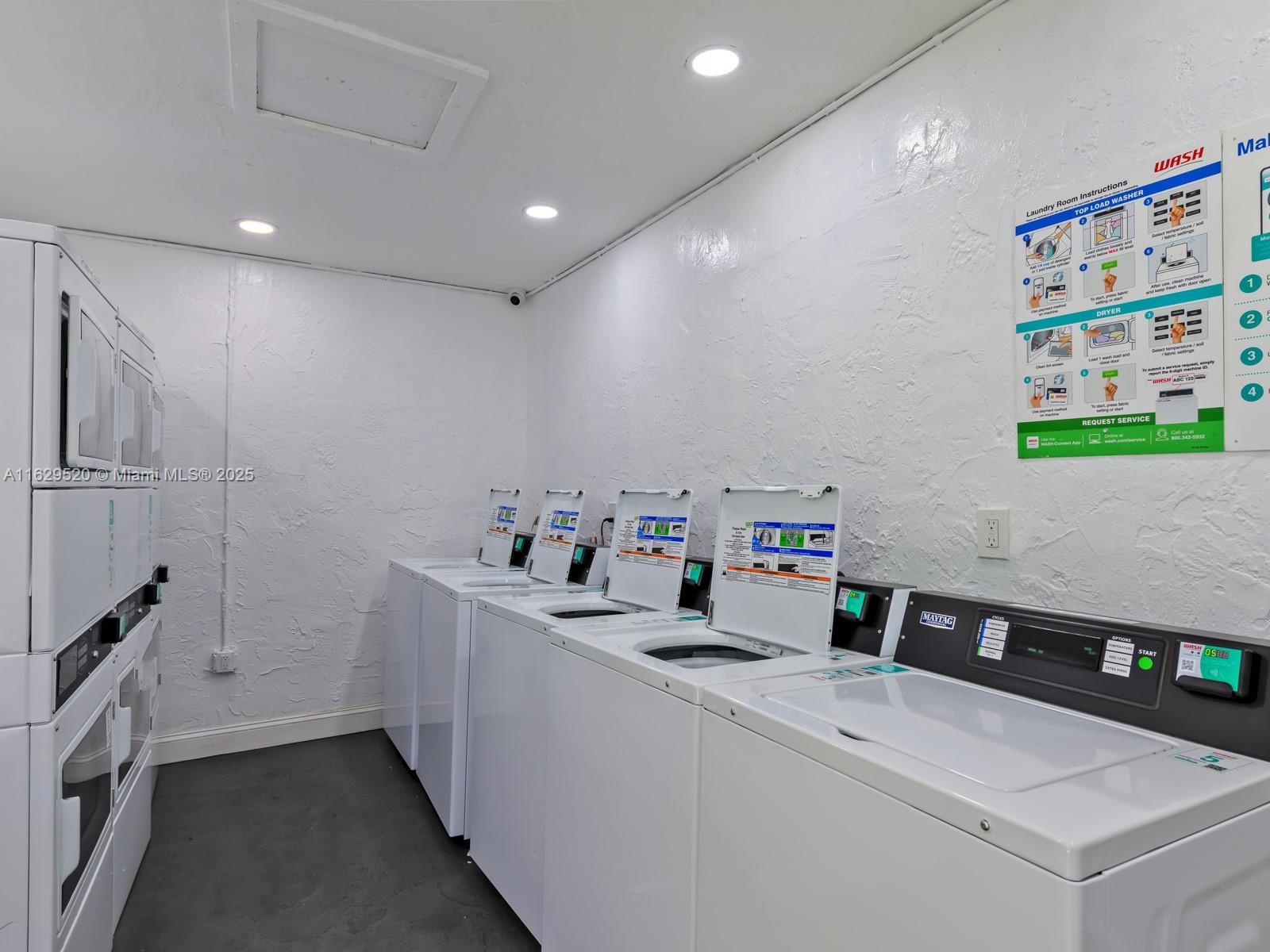 7403 Southwest 82nd Street, Unit 201N Miami, FL 33143 - Photo 40 of 43 a view of storage and utility room with washer and dryer