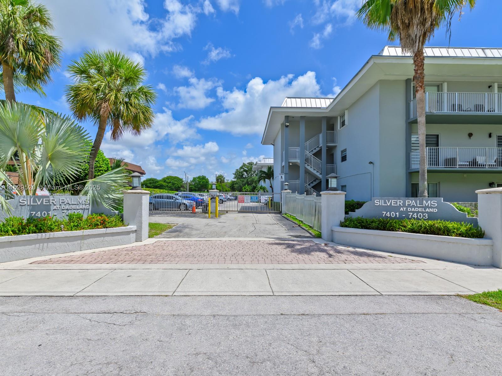 7403 Southwest 82nd Street, Unit 201N Miami, FL 33143 - Photo 4 of 43 front view of house with a street