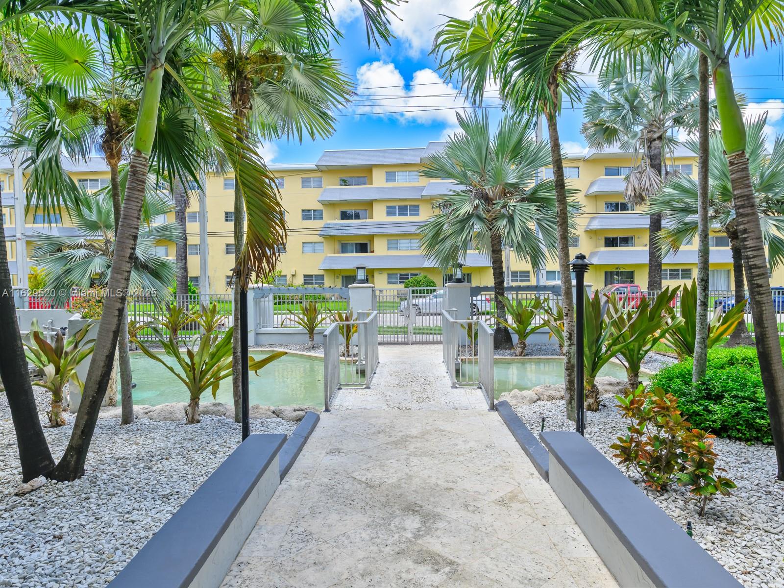 7403 Southwest 82nd Street, Unit 201N Miami, FL 33143 - Photo 41 of 43 a view of a palm tree with a patio