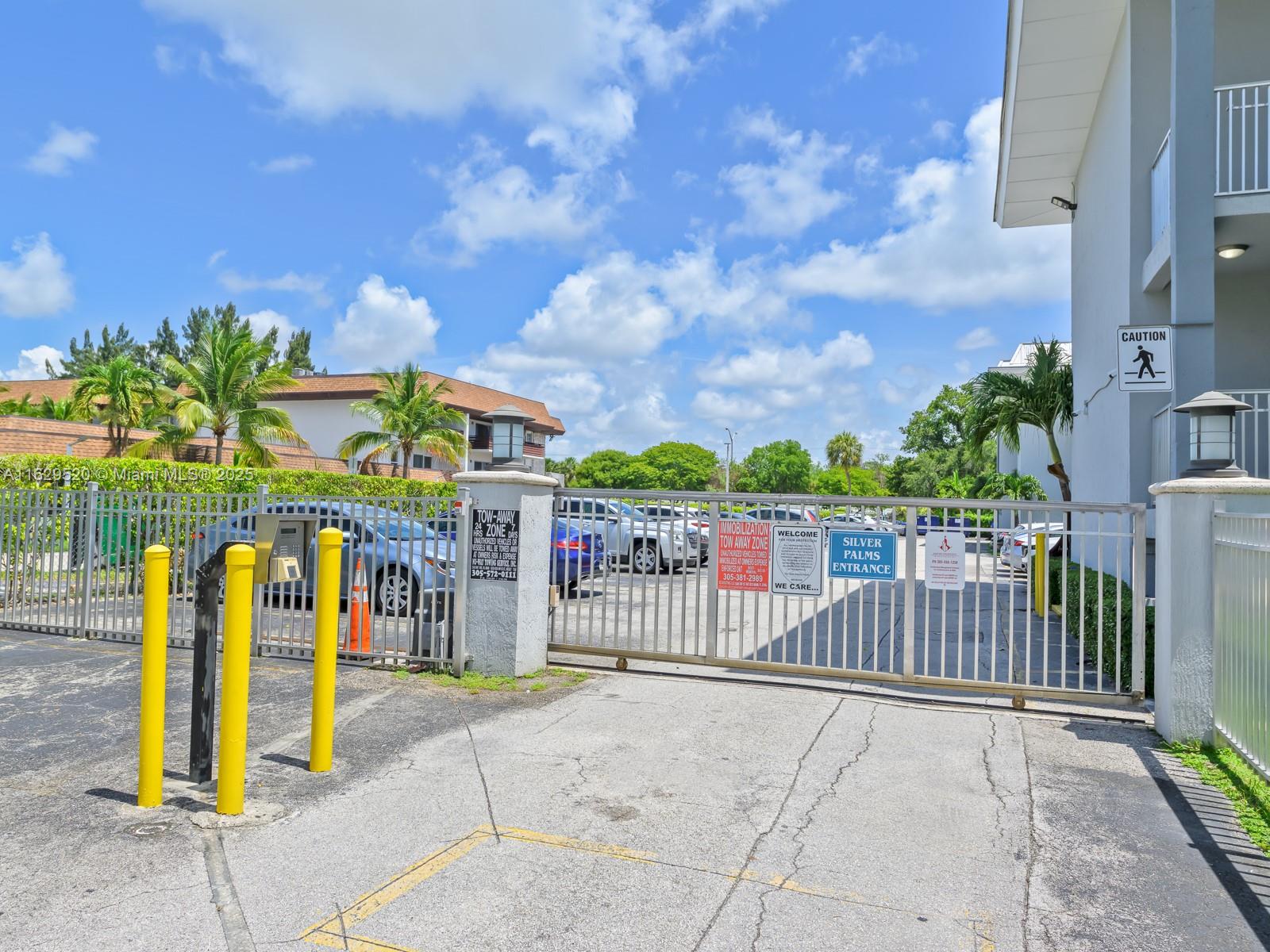 7403 Southwest 82nd Street, Unit 201N Miami, FL 33143 - Photo 5 of 43 a view of a park with iron fence