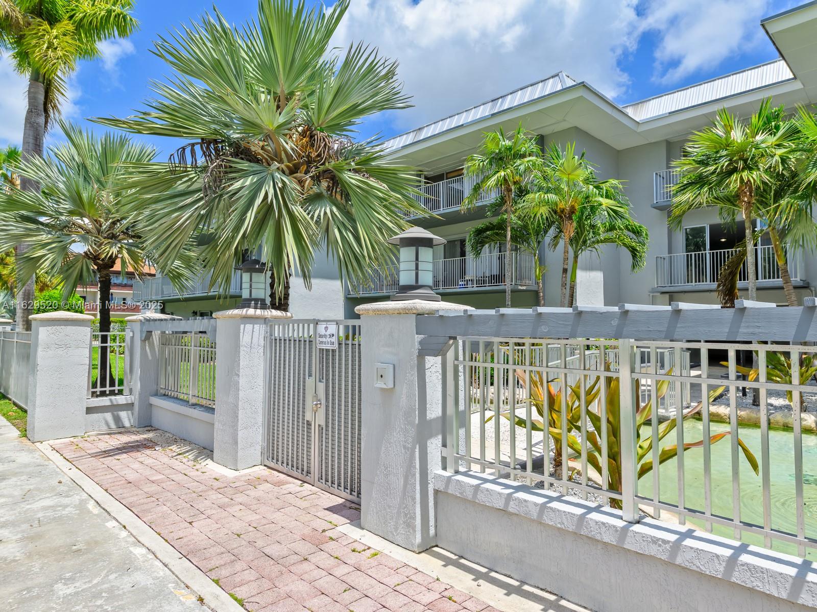 7403 Southwest 82nd Street, Unit 201N Miami, FL 33143 - Photo 6 of 43 a view of balcony with a palm tree