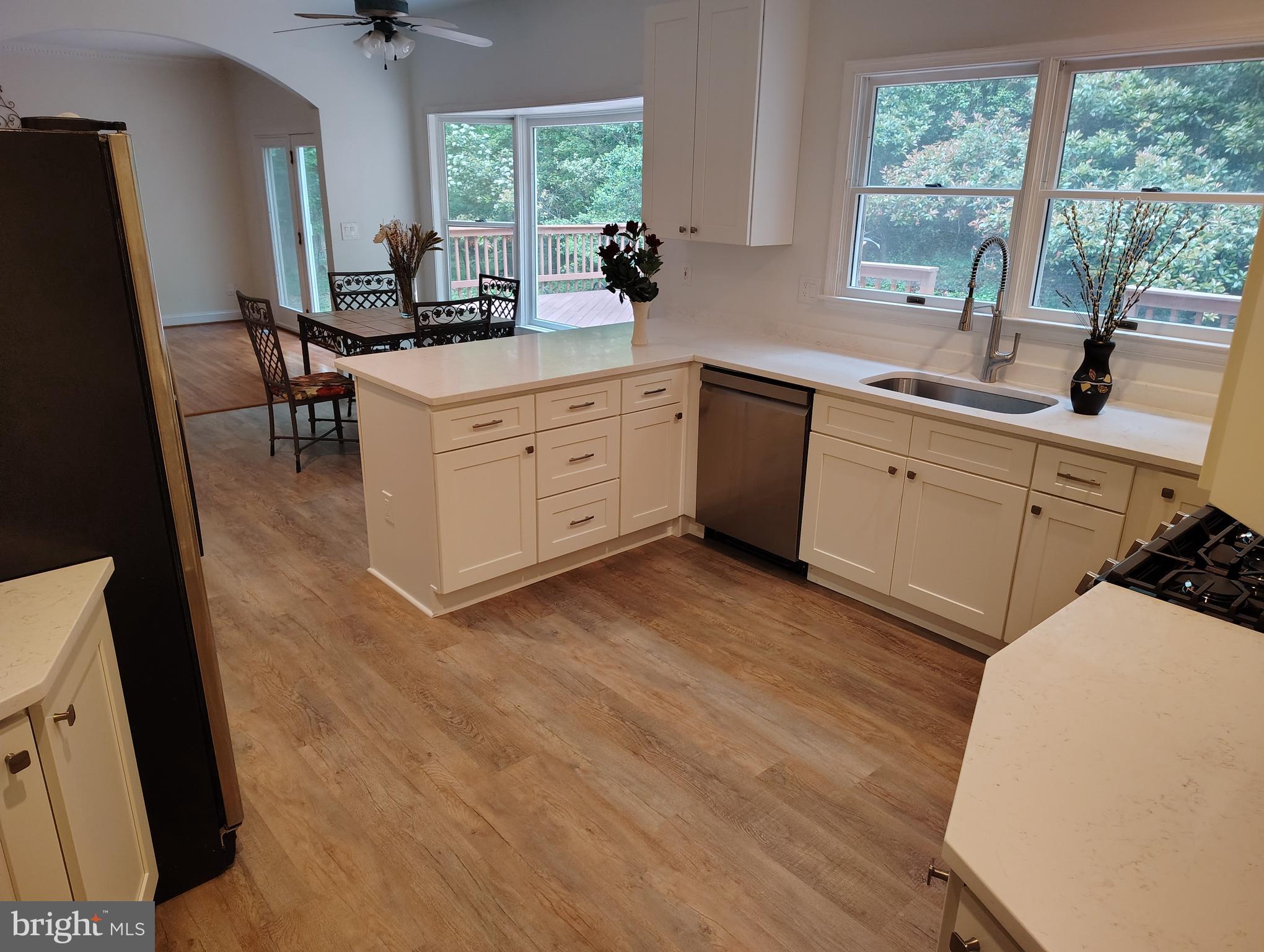 1711 Ritchie Highway Annapolis, MD 21409 - Photo 12 of 16 a kitchen with a sink stove and cabinets