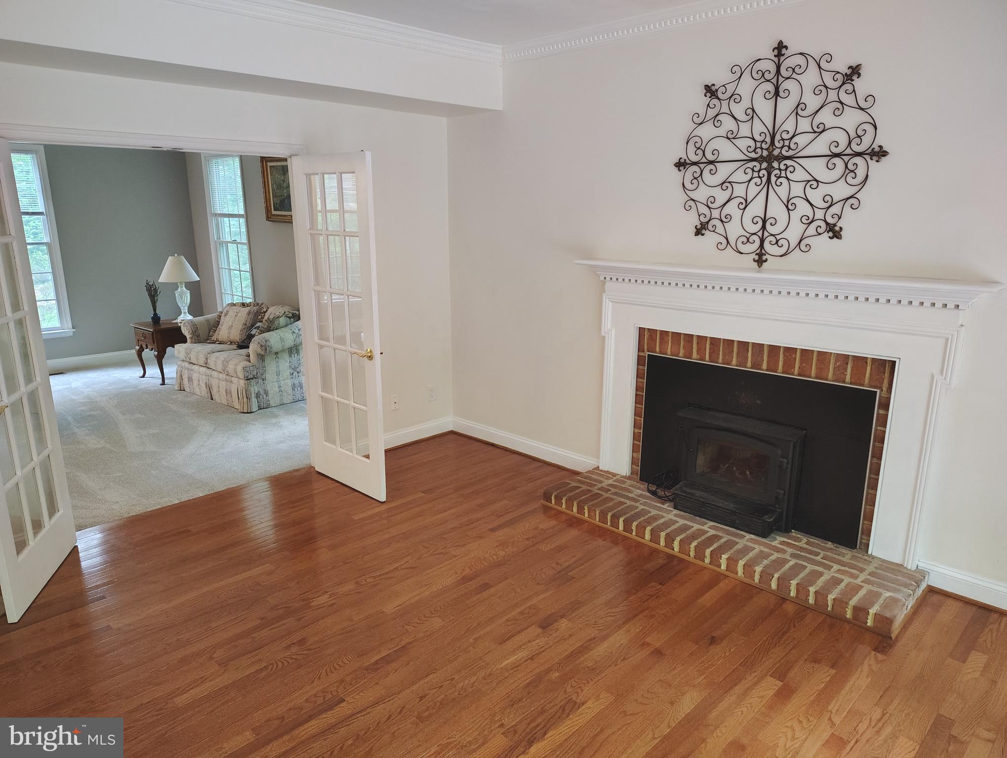 1711 Ritchie Highway Annapolis, MD 21409 - Photo 14 of 16 a view of empty room with wooden floor and fireplace