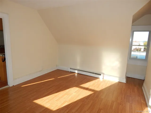 a front view of a building with parking area