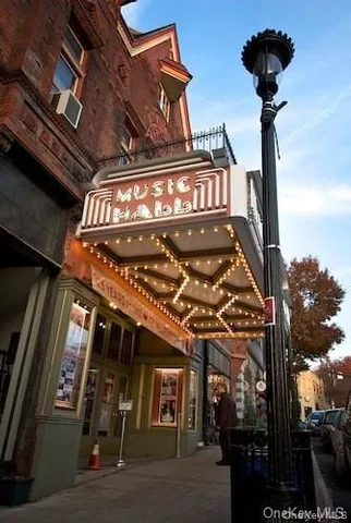 a view of a roof deck with lake and ocean view