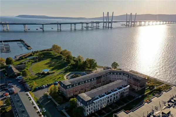 a view of a roof deck with lake and ocean view