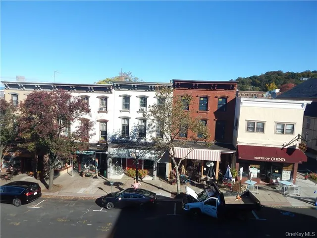 a city street lined with buildings and cars