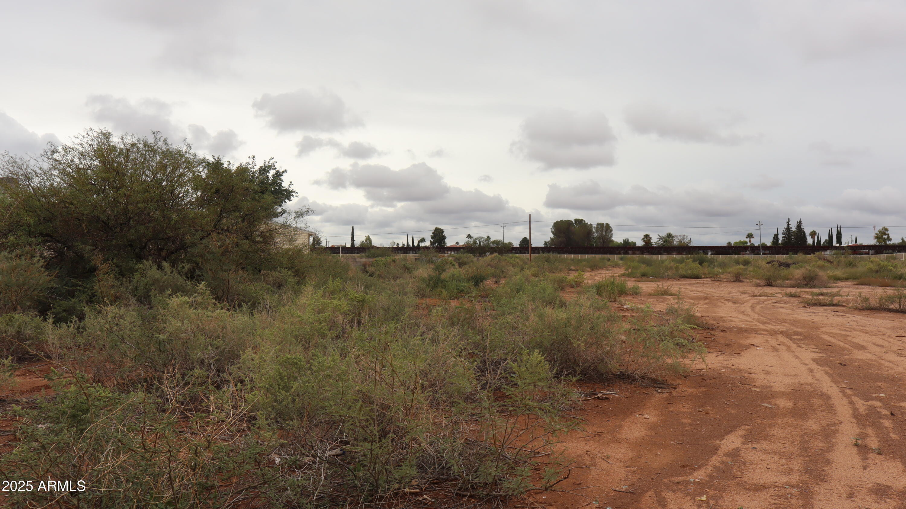 Tbd A Avenue, Unit 40925003 Douglas, AZ 85607 - Photo 3 of 7 a view of a lake with houses in back