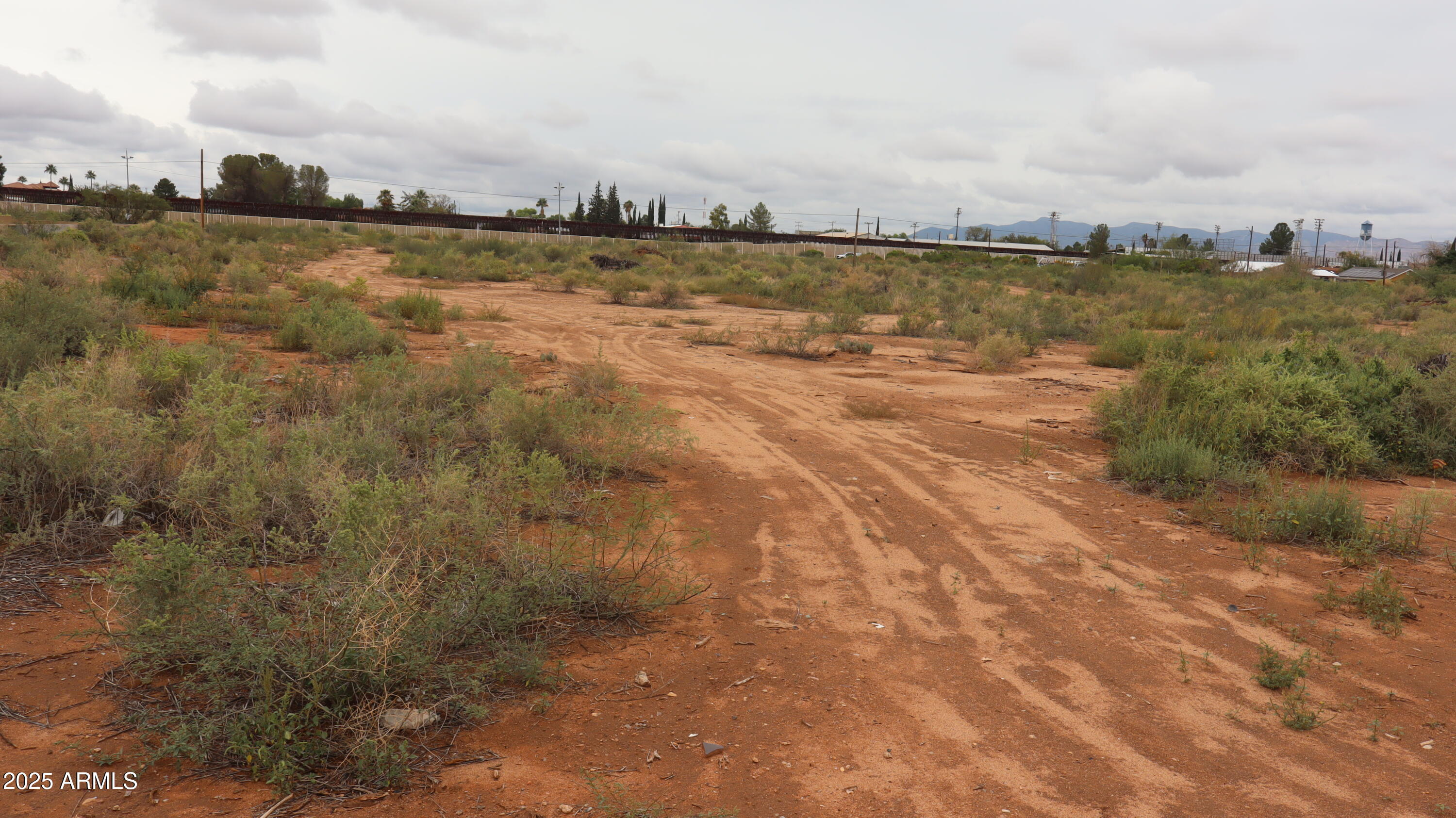 Tbd A Avenue, Unit 40925003 Douglas, AZ 85607 - Photo 5 of 7 a view of a lake with houses in the back