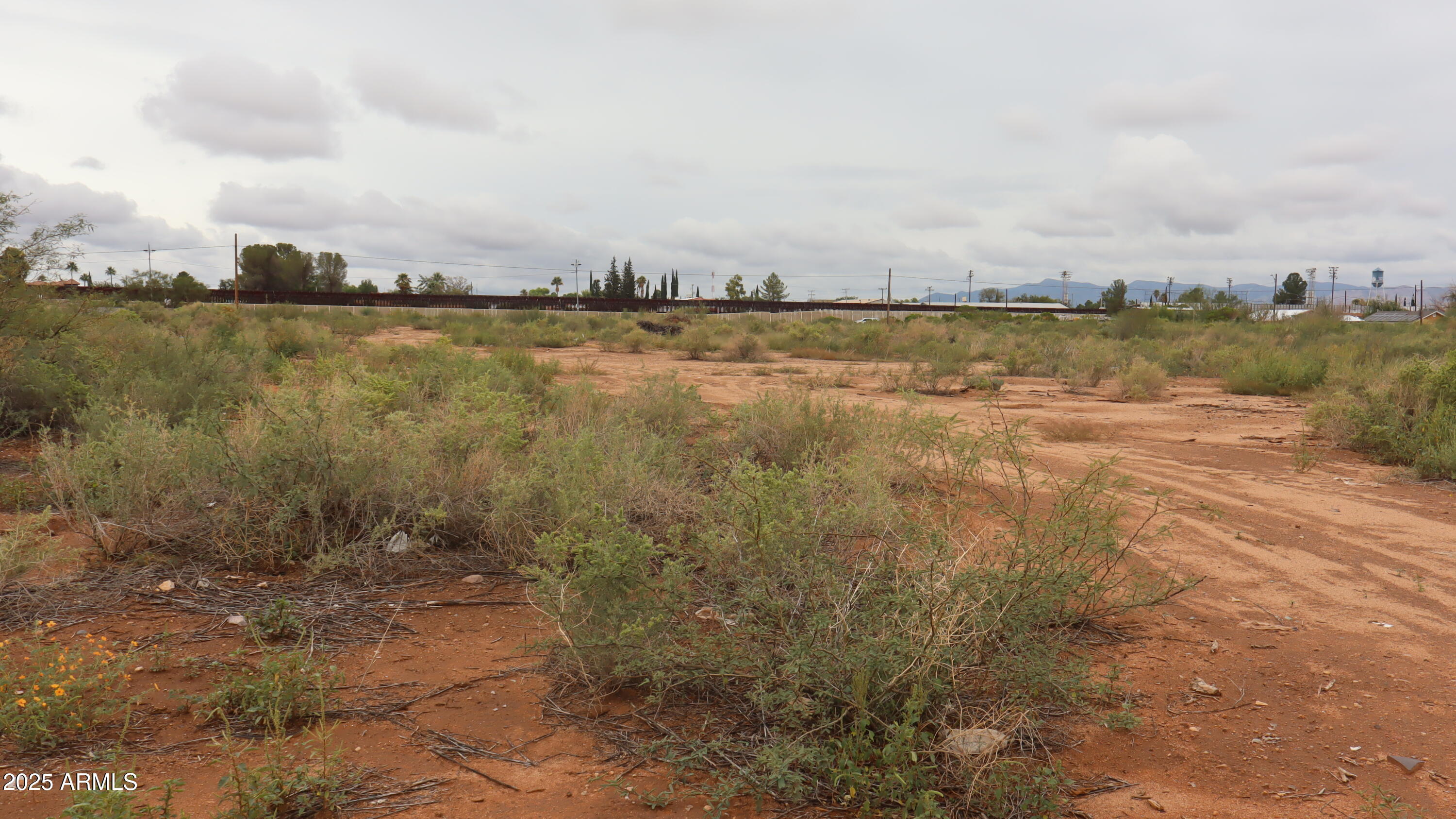 Tbd A Avenue, Unit 40925003 Douglas, AZ 85607 - Photo 6 of 7 a view of a lake with houses in the back