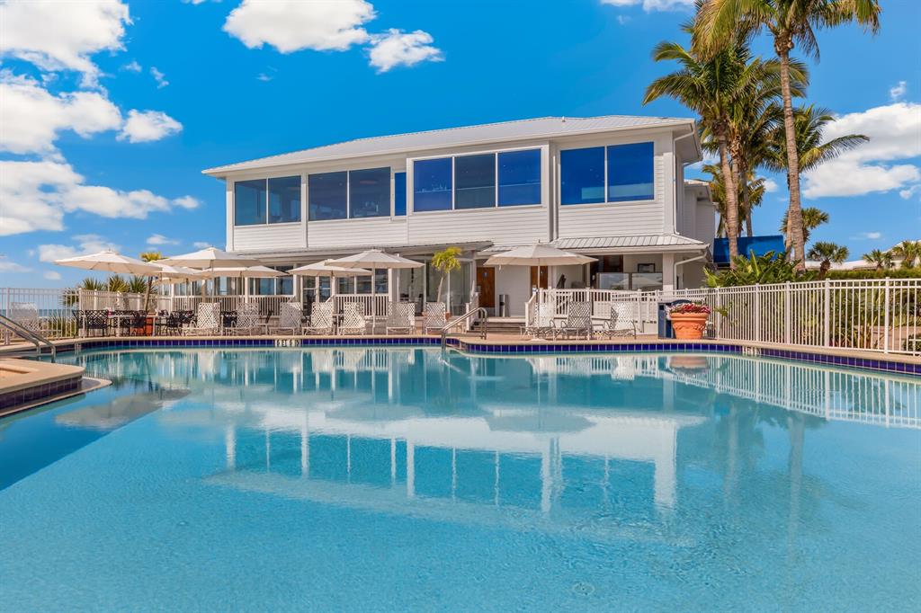 5000 Gasparilla Road, Unit BC105 Boca Grande, FL 33921 - Photo 23 of 33 a view of house with swimming pool and outdoor seating