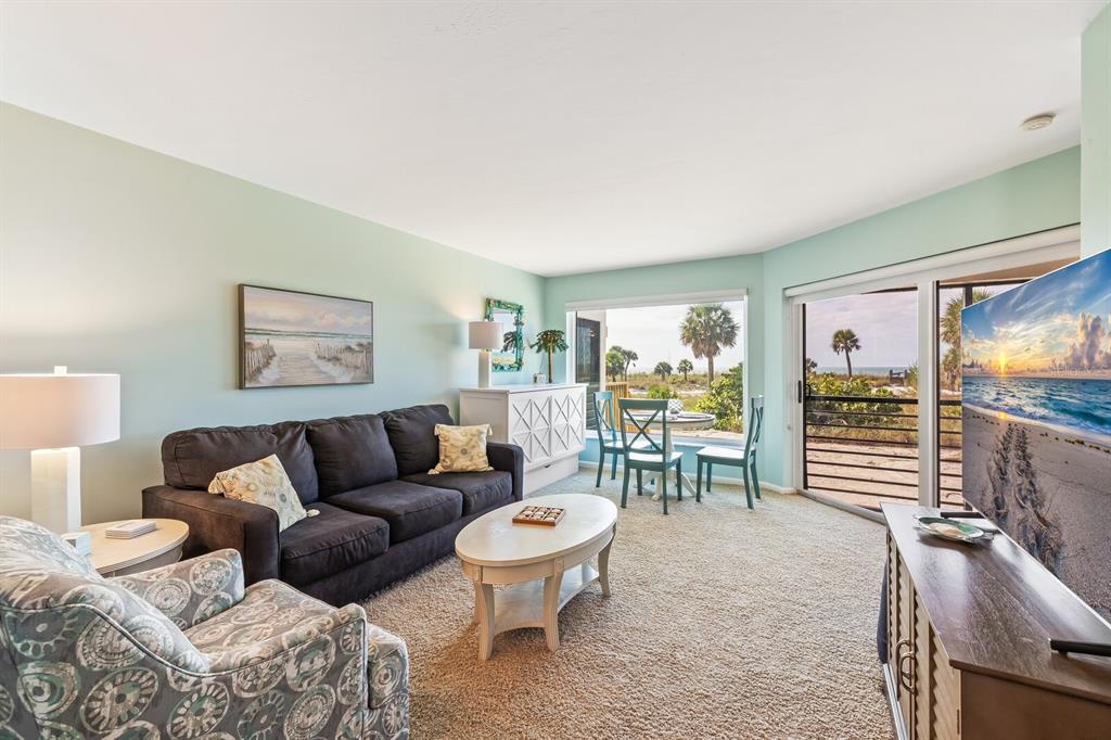 5000 Gasparilla Road, Unit BC105 Boca Grande, FL 33921 - Photo 3 of 33 a living room with furniture and a large window