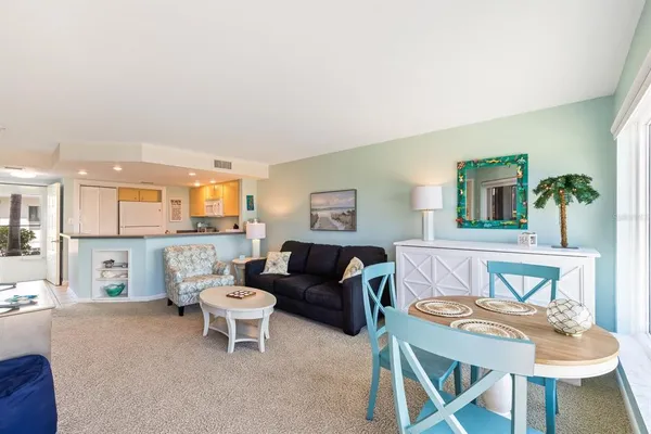 a living room with furniture and a table