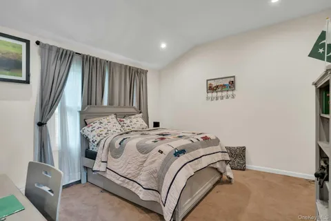 a bedroom with a bed and a cabinets