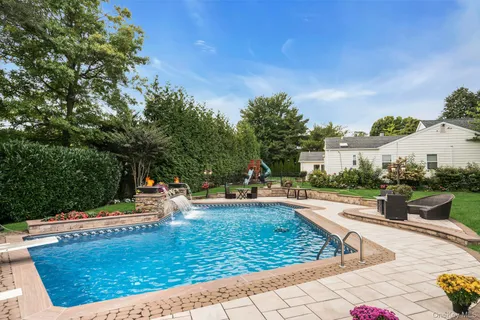 a view of a swimming pool with a patio
