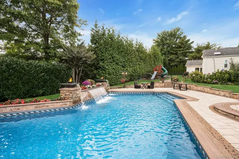 a view of a park with large trees