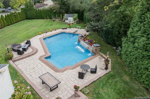 a view of a backyard with sitting area and furniture