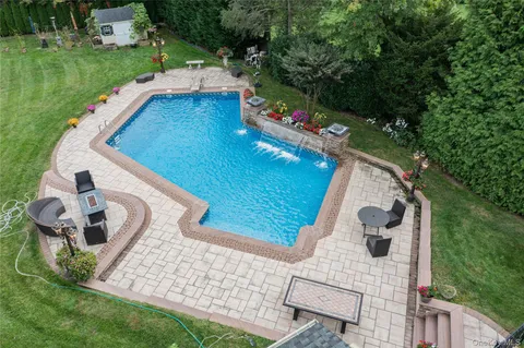 a view of a backyard with sitting area