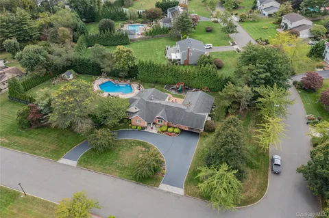 an aerial view of a house with a garden