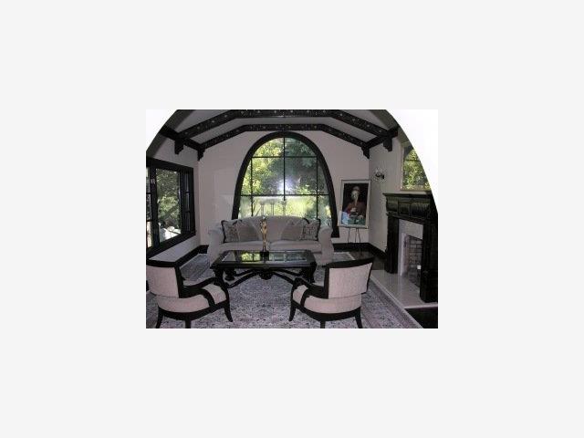 2920 Hillside Drive Burlingame, CA 94010 - Photo 3 of 9 a living room with a couch and a table